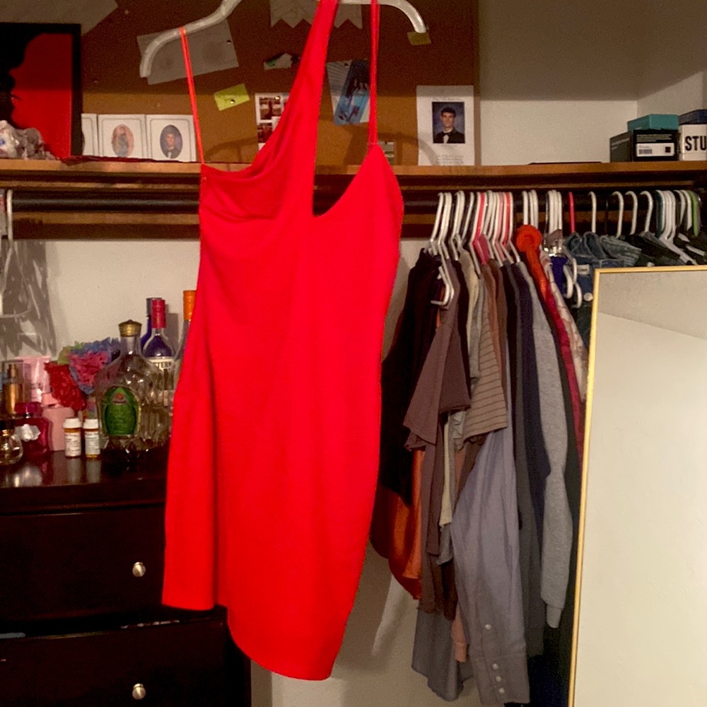 Backless dress about mid thigh length open back both straps on left shoulder
